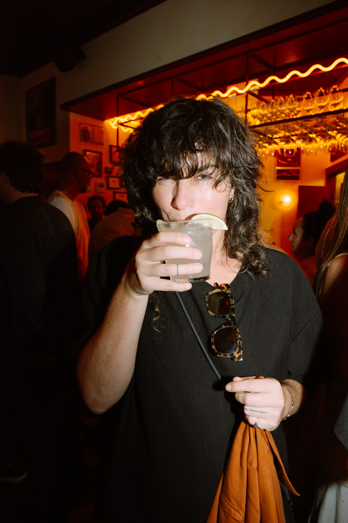 Guest with a cocktail at the afterparty