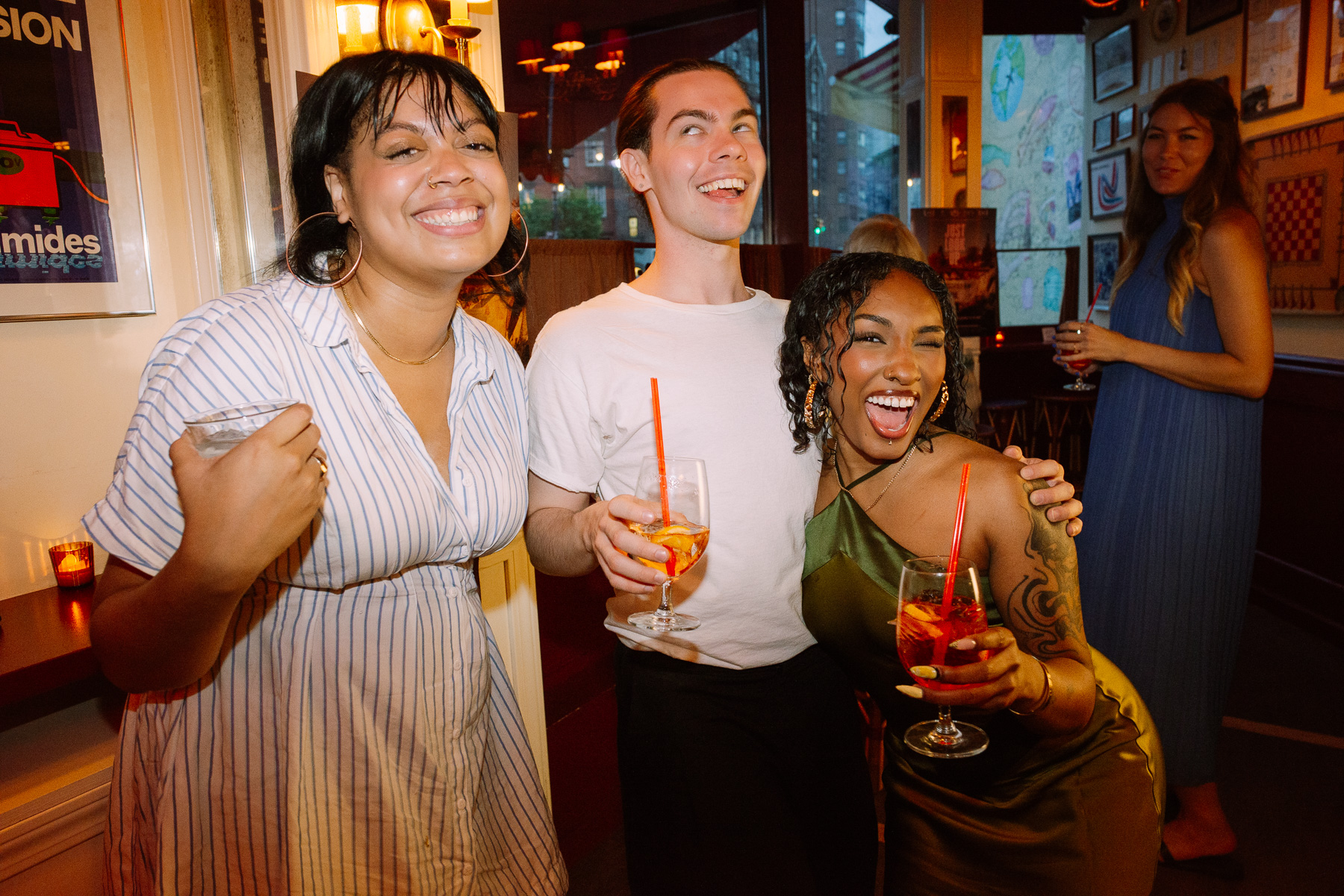 Friends laughing at the afterparty bar
