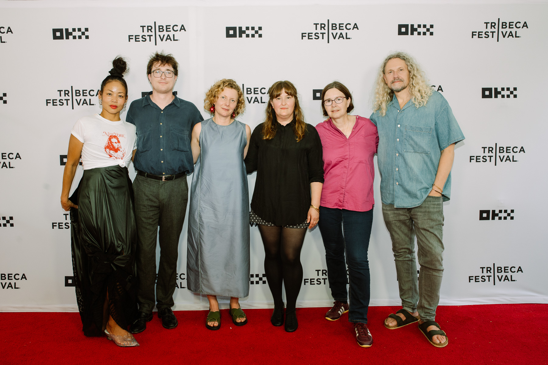 Creative team on the red carpet step-and-repeat