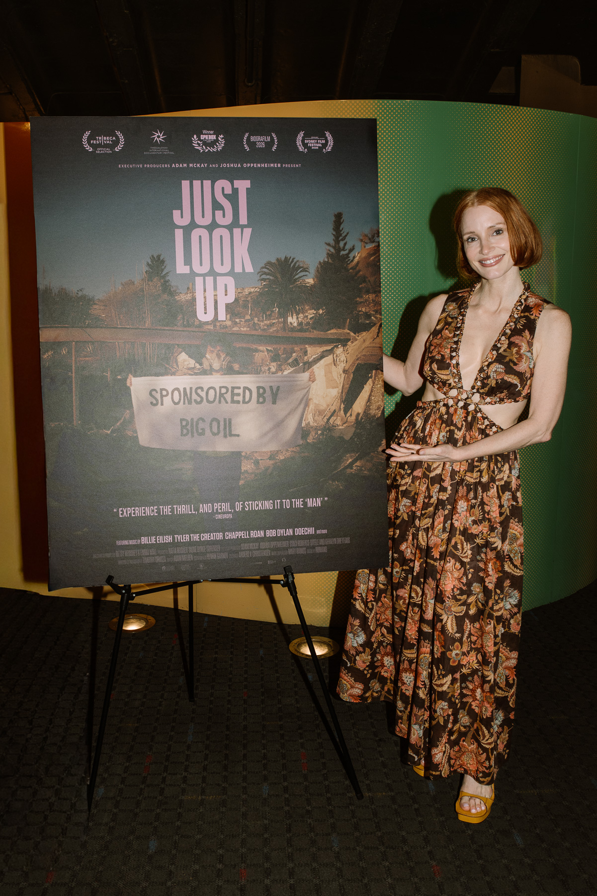Guest beside the Just Look Up poster