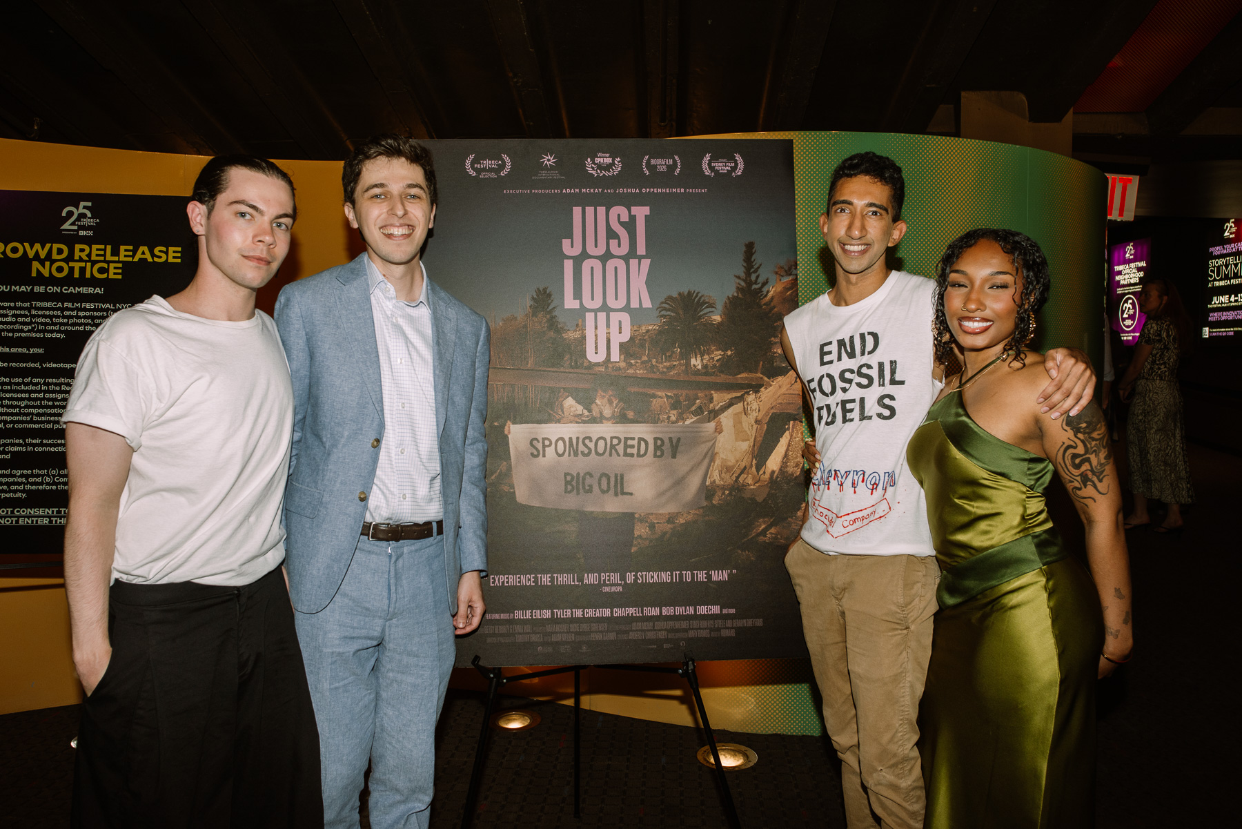 Guests posing at the lobby poster