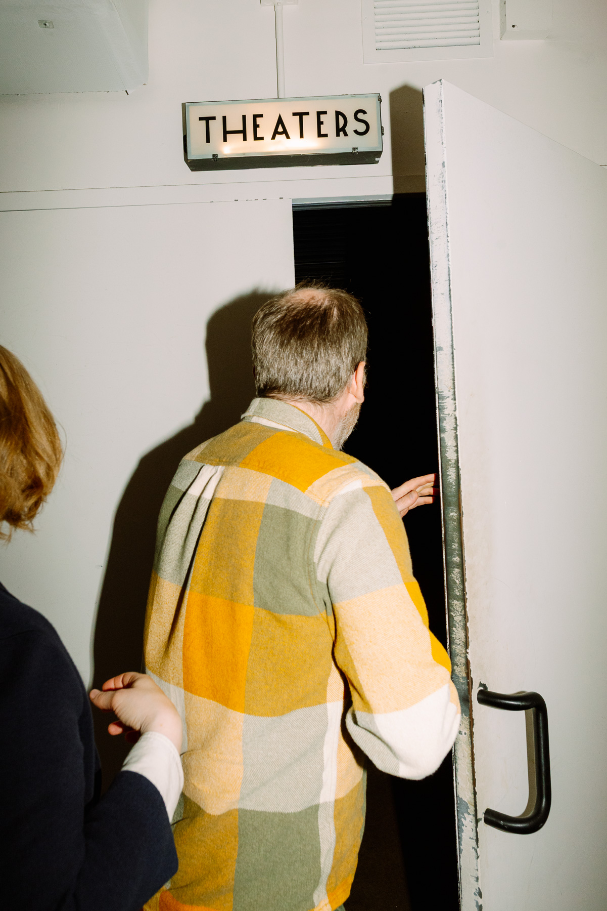 Guest heading through the Metrograph theater doors