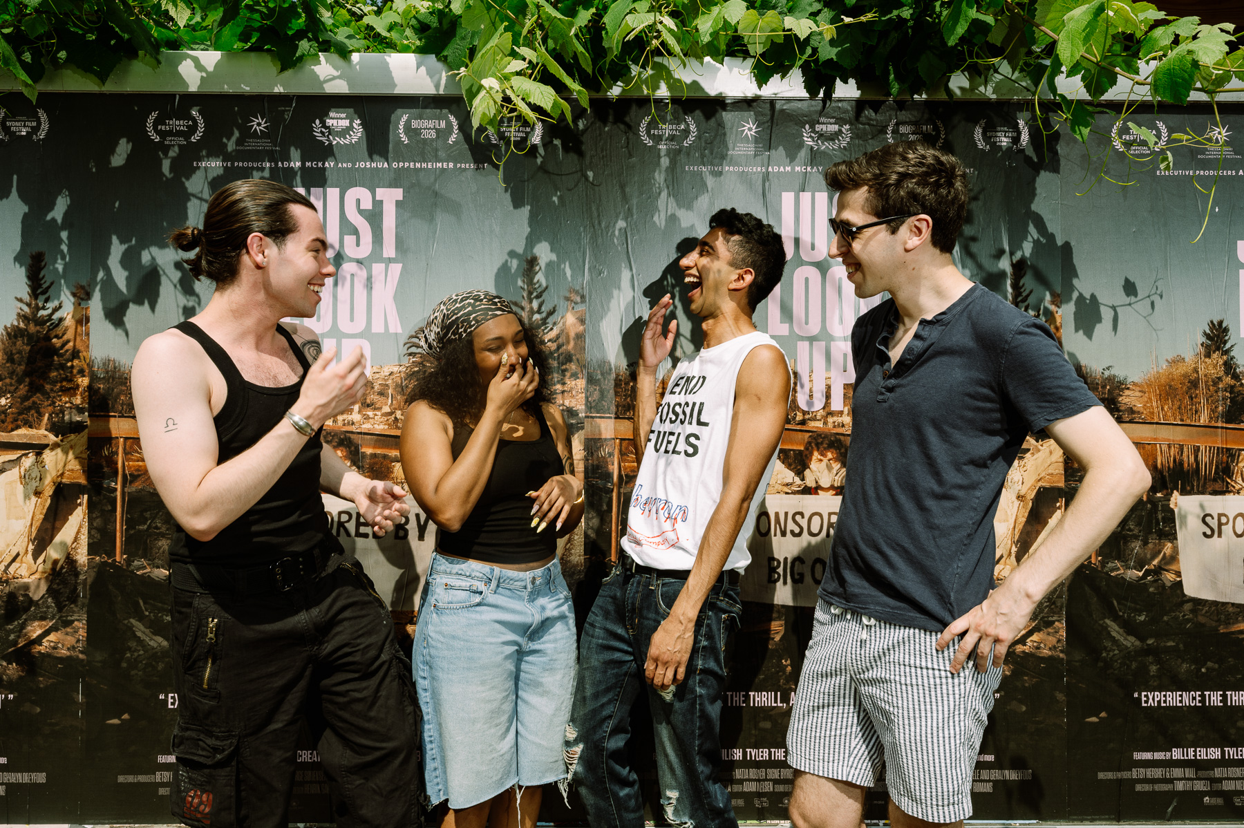 Group laughing at the wild-posting wall