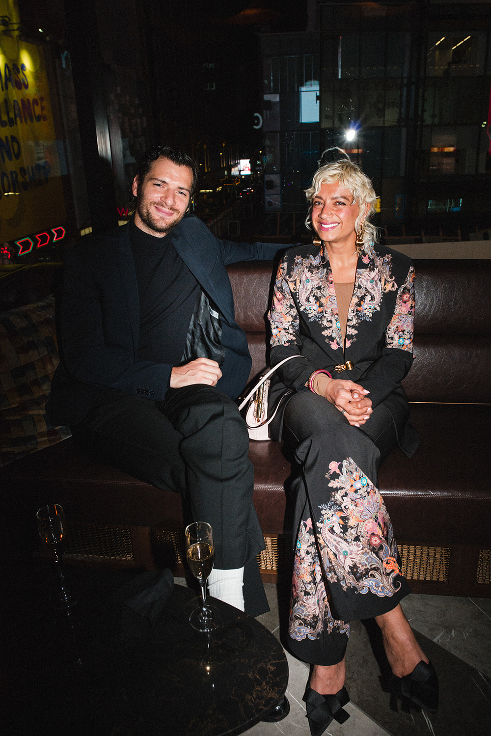 Guests seated together with champagne