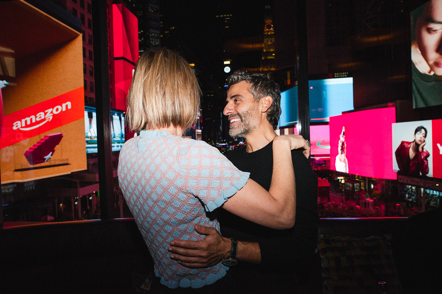 Couple embracing with the skyline in view