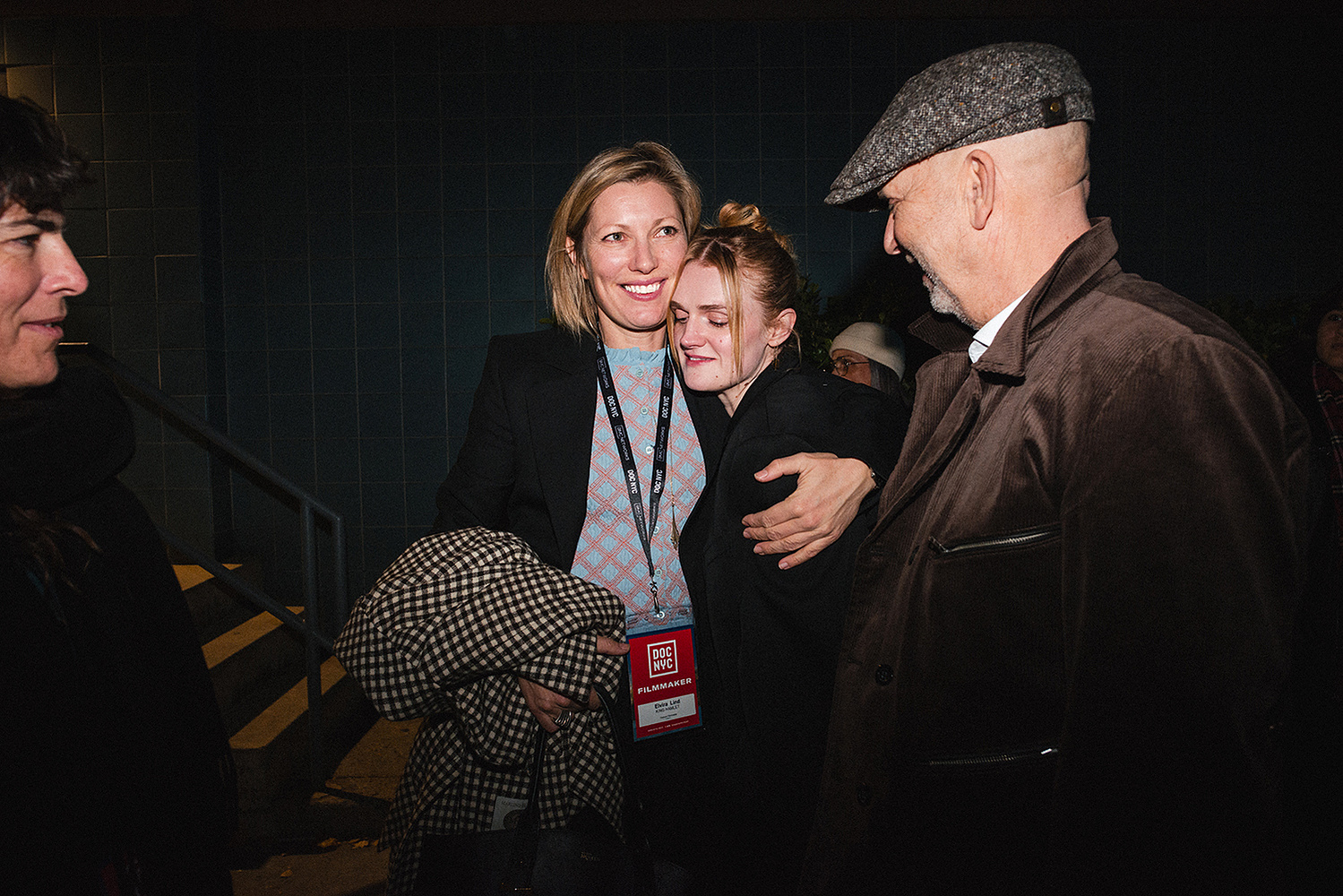 Close embrace beside the filmmaker's credential badge