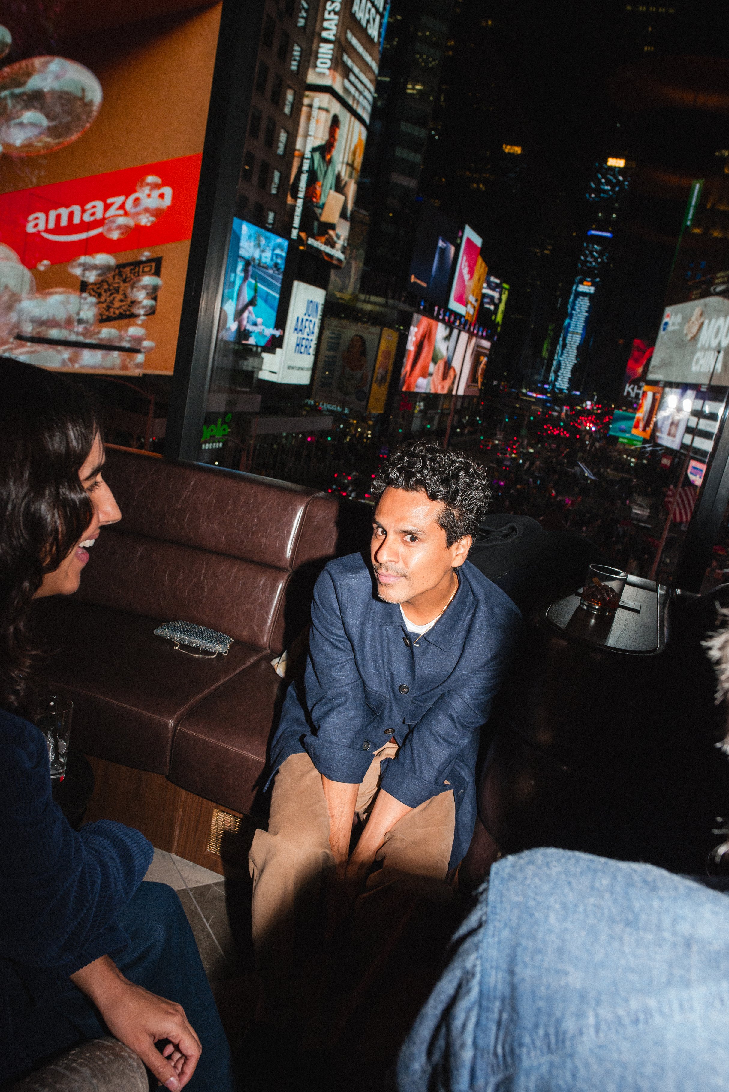 Guest seated by the window above Times Square