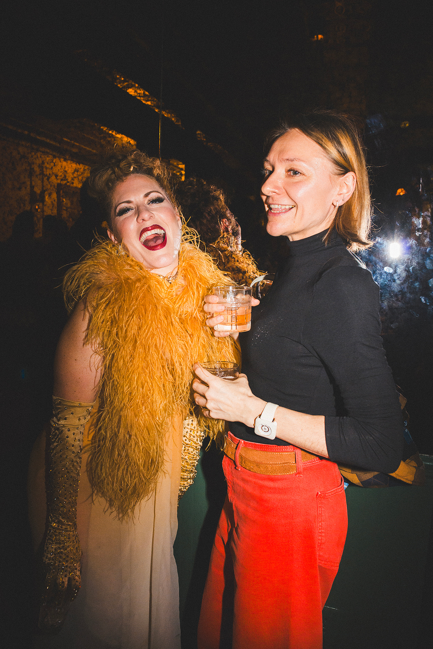 Two guests laughing together