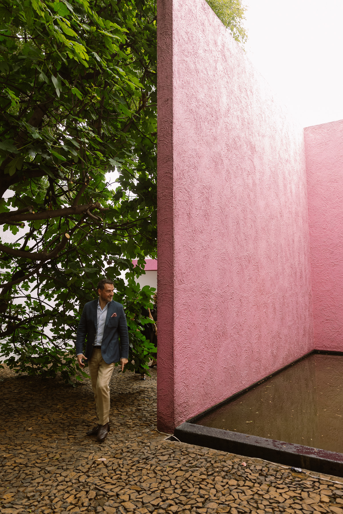 Guest walking into the pink courtyard