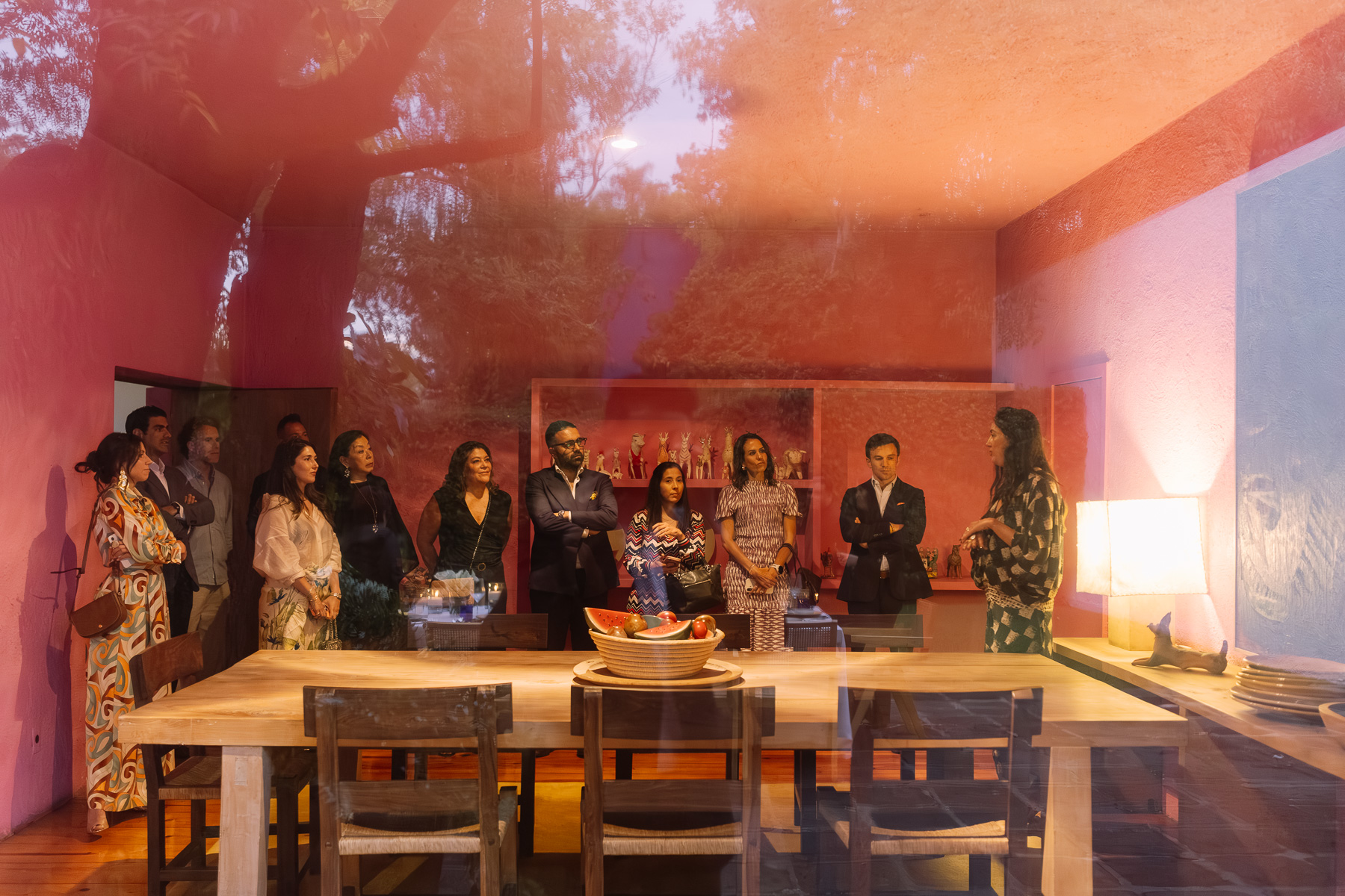 Guests gathered in the pink dining room