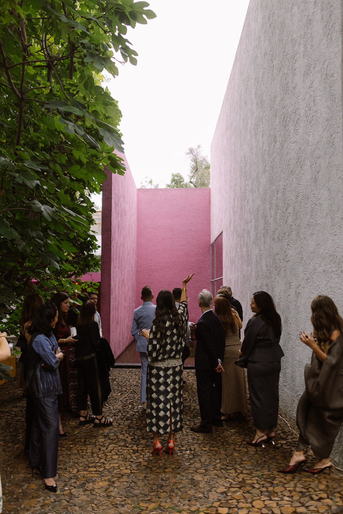 Guests touring the pink courtyard alley