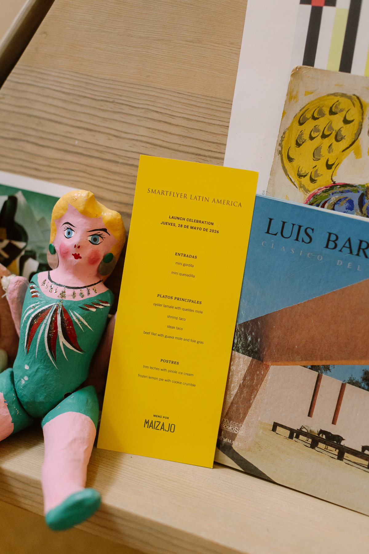SmartFlyer launch menu beside a folk art doll