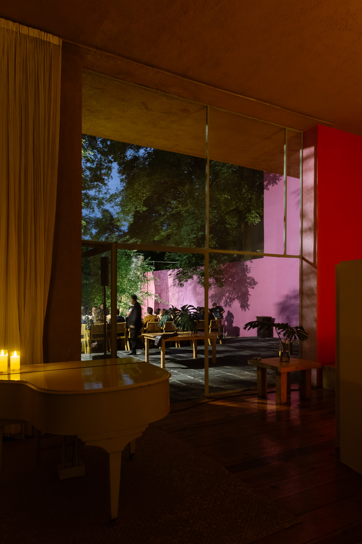 Warm lit room at night looking to the pink wall